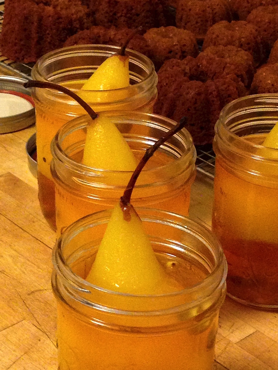 poached pears in bell jars